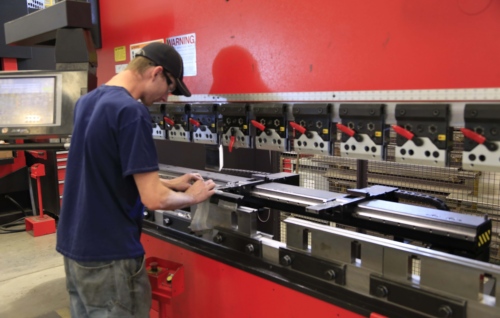 The operator bends on a press brake